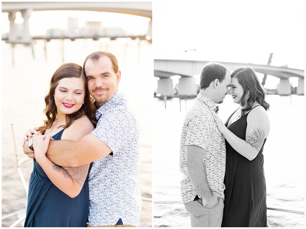 Beautiful couple posing on a boat infront of a Jacksonville bridge. 