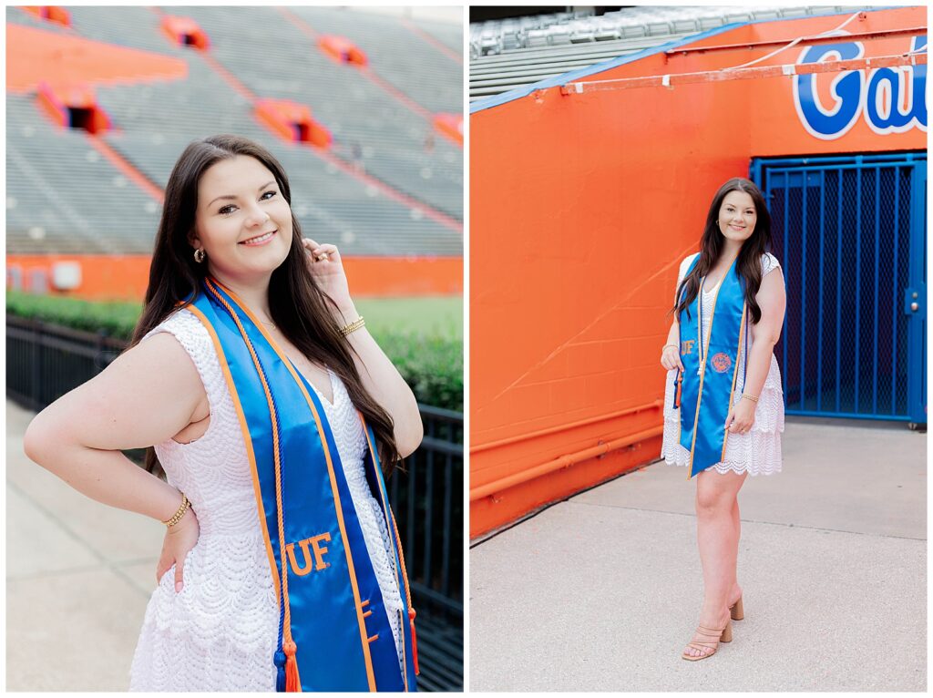 UF graduate smiling confidently while wearing a white dress and blue and orange stole, posing near the stadium seating and in front of the bright orange Gators tunnel at Ben Hill Griffin Stadium.