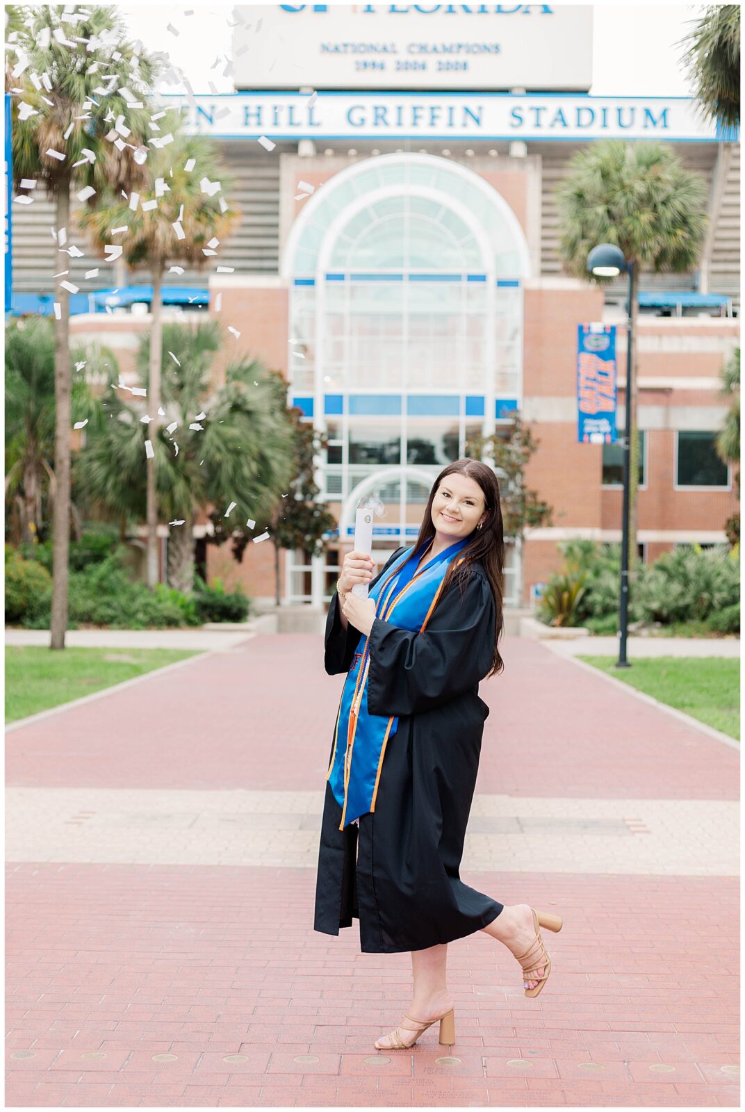 Summer UF grad session at Ben Hill Griffin Stadium with a University of Florida graduate celebrating with confetti