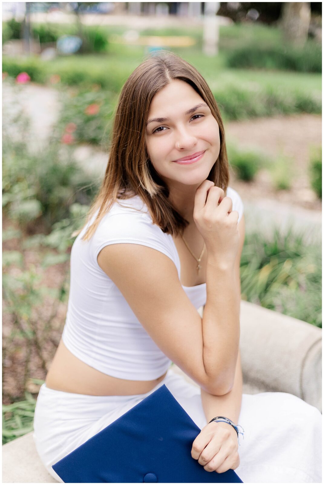 Close-up and full-body views of a University of North Florida graduate captured during her campus senior portraits